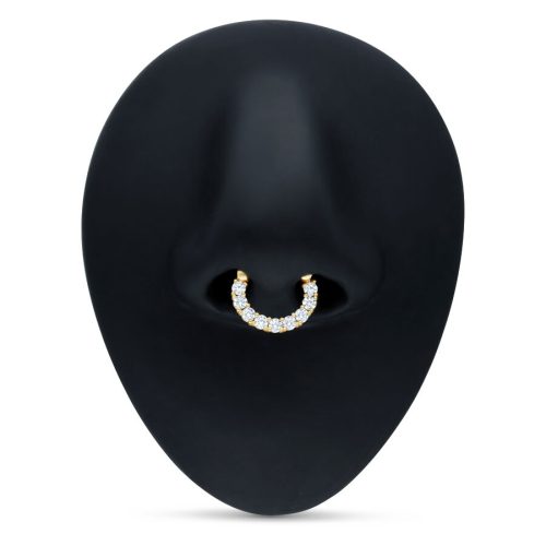 Goldener Septum Clicker mit klaren Kristallen auf schwarzem Hintergrund