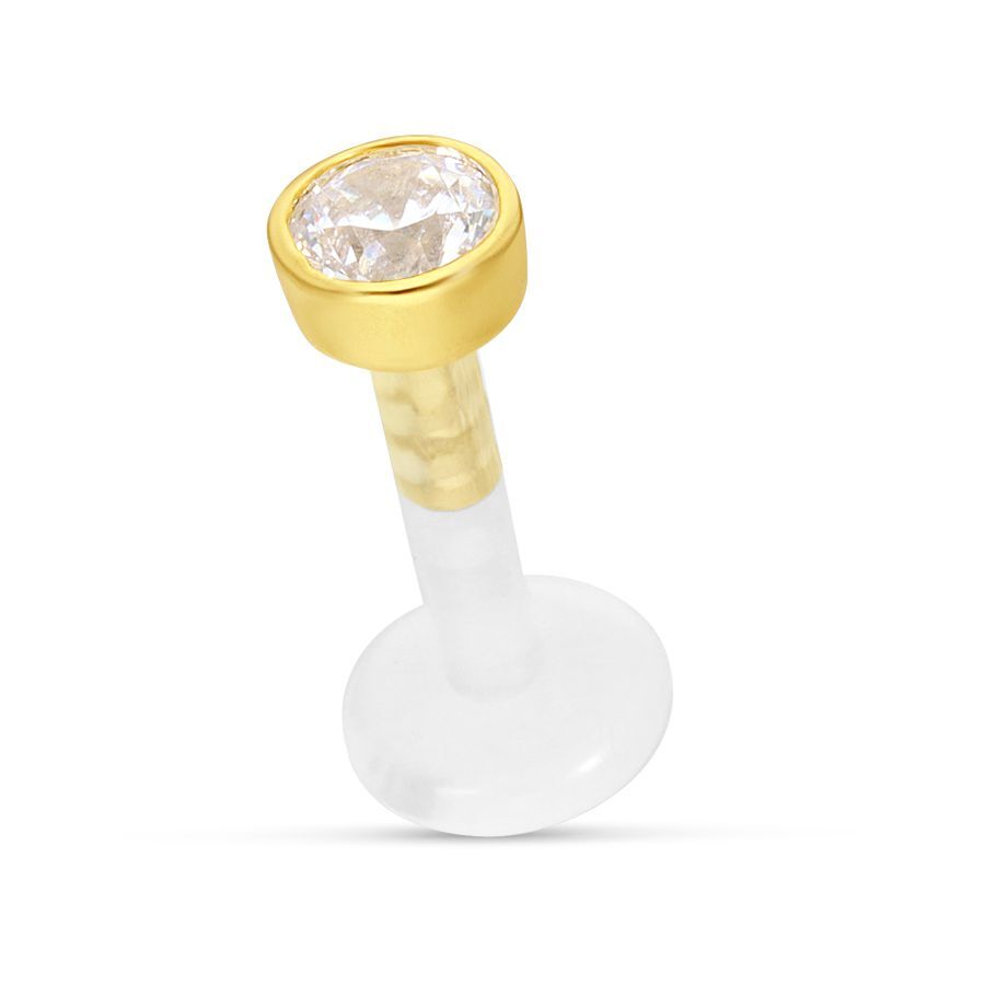 Labret mit goldener Fassung und klarem Kristall auf weißem Hintergrund