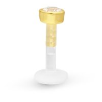 Goldenes Labret mit Kristall auf weißem Hintergrund
