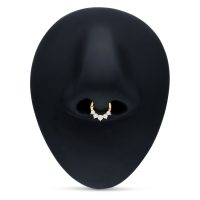 Goldener Septum Clicker mit klaren Kristallen auf schwarzem Hintergrund