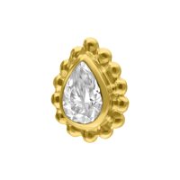 Goldener Aufsatz mit tropfenförmigem Kristall auf weißem Hintergrund