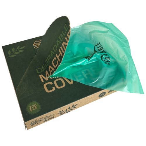 Grüne biologischabbaubare Maschinenhülle auf Kartonverpackung