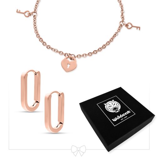 Roségoldenes Armband mit Schloss- und Schlüsseldesign neben roségoldenen Ohrringen und einer schwarzen Wildcat-Schachtel
