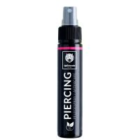 Schwarze Piercingspray-Flasche mit grauem Sprühkopf auf weißem Hintergrund