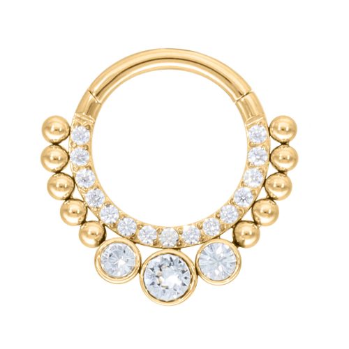 Goldener Septum Clicker mit klaren Kristallen auf weißem Hintergrund