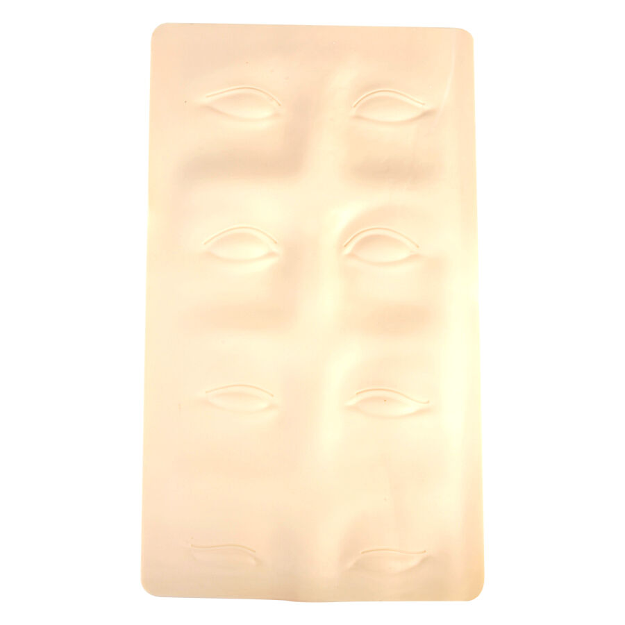 Beige Silikonplatte mit Augenbrauenkonturen auf weißem Hintergrund