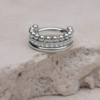 Silberner Triple Bubble Crystal Clicker auf hellem Stein