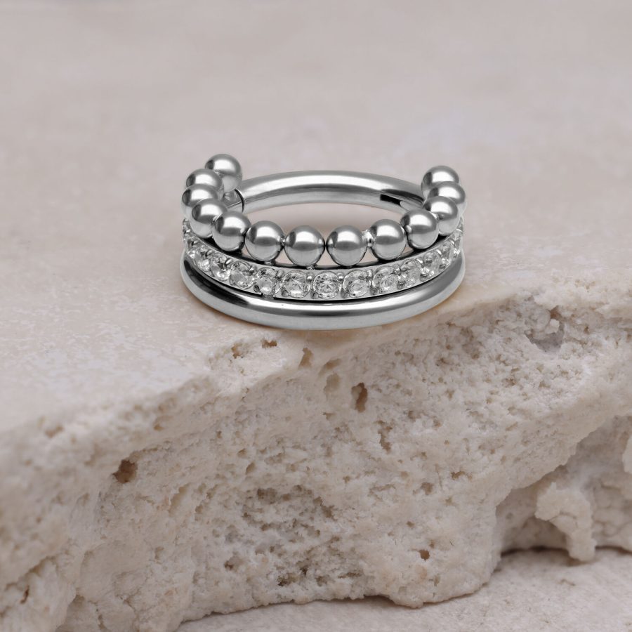 Silberner Triple Bubble Crystal Clicker auf hellem Stein