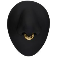 Goldener Septum Clicker mit Leopardenmuster auf schwarzem Hintergrund